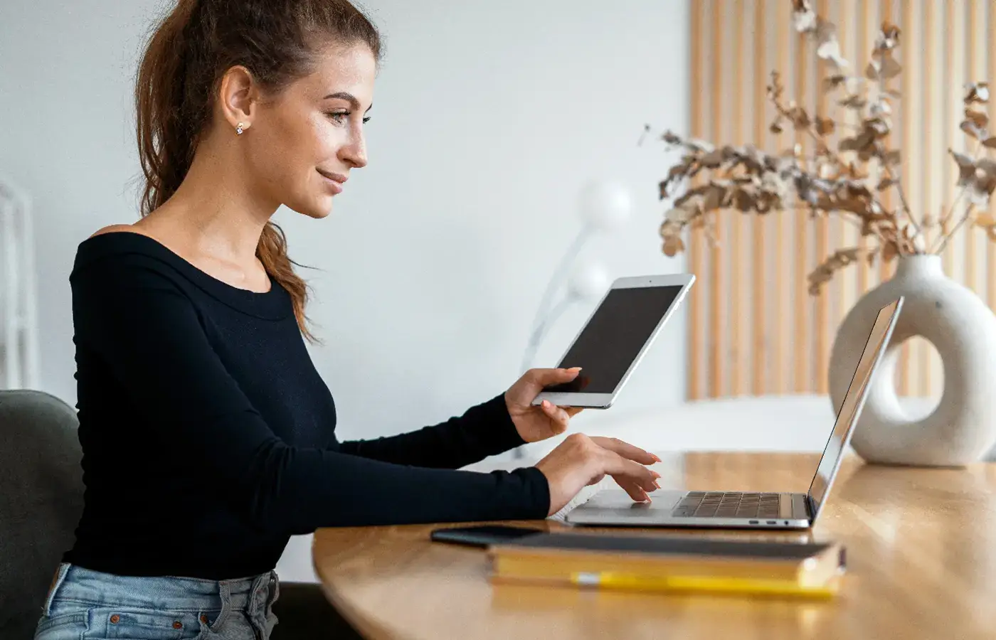 Happy woman reviewing merchant credit card statement